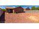 Backyard view of house with gravel and block wall at 36532 W Barcelona Ln, Maricopa, AZ 85138