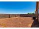 Large backyard with gravel and block wall at 36532 W Barcelona Ln, Maricopa, AZ 85138
