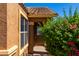 Front door entrance with a decorative glass insert and walkway at 36532 W Barcelona Ln, Maricopa, AZ 85138