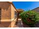 Front door entrance with a decorative glass insert and walkway at 36532 W Barcelona Ln, Maricopa, AZ 85138