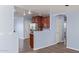 Kitchen with dark wood cabinets, stainless steel appliances, and tile floors at 36532 W Barcelona Ln, Maricopa, AZ 85138