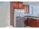 Modern kitchen with stainless steel refrigerator and dishwasher at 36532 W Barcelona Ln, Maricopa, AZ 85138