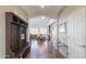 Entryway with wood floors, bench, and view to dining area at 3730 E Kingbird Pl, Chandler, AZ 85286