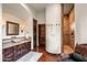 Spa-like bathroom with walk-in shower, double vanity, and stone finishes at 40980 N 97Th St, Scottsdale, AZ 85262