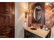 Elegant bathroom with ornate vanity and large mirror at 40980 N 97Th St, Scottsdale, AZ 85262