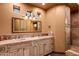 Elegant bathroom with double vanity and large mirror at 40980 N 97Th St, Scottsdale, AZ 85262