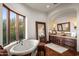 Bathroom with soaking tub, double vanity, and expansive views at 40980 N 97Th St, Scottsdale, AZ 85262