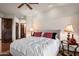 Comfortable bedroom with ceiling fan and access to hallway bathroom at 40980 N 97Th St, Scottsdale, AZ 85262