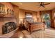 Cozy bedroom with fireplace, southwestern decor, and large window at 40980 N 97Th St, Scottsdale, AZ 85262