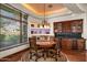 Charming breakfast nook with a round table, built-in cabinetry, and wine rack at 40980 N 97Th St, Scottsdale, AZ 85262