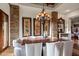 Formal dining room features a wood table and chairs, and artwork at 40980 N 97Th St, Scottsdale, AZ 85262