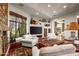 Gathering room includes a fireplace, large TV, and comfortable seating at 40980 N 97Th St, Scottsdale, AZ 85262