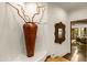 Elegant hallway features a large copper vase and ornate mirror at 40980 N 97Th St, Scottsdale, AZ 85262