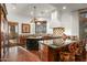 Open kitchen with large island, granite counters, and professional range at 40980 N 97Th St, Scottsdale, AZ 85262