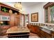 Island kitchen with granite countertops and custom cabinetry at 40980 N 97Th St, Scottsdale, AZ 85262