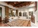 Spacious living area with a cozy sectional sofa and stone pillars at 40980 N 97Th St, Scottsdale, AZ 85262