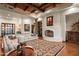Spacious living room with a stone fireplace and large windows at 40980 N 97Th St, Scottsdale, AZ 85262