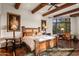 Bright main bedroom with rustic bed frame and large window views at 40980 N 97Th St, Scottsdale, AZ 85262