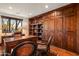 Home office with built-in bookshelves and custom desk at 40980 N 97Th St, Scottsdale, AZ 85262