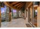 Stone patio with mountain views, pool access, and unique lighting at 40980 N 97Th St, Scottsdale, AZ 85262