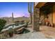 Luxury pool and spa with stone accents at 40980 N 97Th St, Scottsdale, AZ 85262