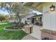 Inviting front porch with brick pillars, rocking chairs, and landscape at 4124 N 64Th N St, Scottsdale, AZ 85251