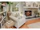 Cozy living room with a stone fireplace and built-in shelving at 4124 N 64Th St, Scottsdale, AZ 85251