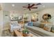 Open living space seamlessly connecting to kitchen, featuring hardwood floors and ample natural light at 4124 N 64Th St, Scottsdale, AZ 85251