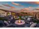 Stunning sunset view of backyard pool and patio at 41240 N Shadow Creek Ct, Anthem, AZ 85086