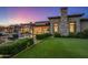 Luxury backyard oasis with pool and stone accents at dusk at 42638 N Chiricahua Pass, Scottsdale, AZ 85262