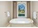 Freestanding bathtub with marble surround and view at 42638 N Chiricahua Pass, Scottsdale, AZ 85262