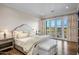 Bright bedroom with king bed and access to balcony at 42638 N Chiricahua Pass, Scottsdale, AZ 85262