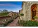 Stone exterior with brick pathway and landscaping at 42638 N Chiricahua Pass, Scottsdale, AZ 85262
