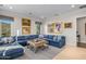 Gathering room with sectional sofa and large artwork at 42638 N Chiricahua Pass, Scottsdale, AZ 85262