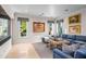 Gathering room with sectional sofa and large artwork at 42638 N Chiricahua Pass, Scottsdale, AZ 85262