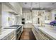 Gourmet kitchen with marble countertops, high-end appliances, and custom cabinetry at 42638 N Chiricahua Pass, Scottsdale, AZ 85262