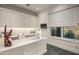 Home office with built-in cabinetry and large window at 42638 N Chiricahua Pass, Scottsdale, AZ 85262