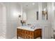 Powder room with marble vanity and ornate mirror at 42638 N Chiricahua Pass, Scottsdale, AZ 85262