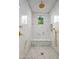 Elegant shower with marble tile and gold fixtures at 42638 N Chiricahua Pass, Scottsdale, AZ 85262