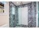 Large walk-in shower with marble tile and glass enclosure at 42638 N Chiricahua Pass, Scottsdale, AZ 85262