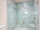 Elegant shower with marble tile and glass enclosure at 42638 N Chiricahua Pass, Scottsdale, AZ 85262