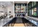Elegant wet bar with extensive liquor storage at 42638 N Chiricahua Pass, Scottsdale, AZ 85262