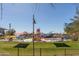 Community pool area with tables, chairs, and umbrellas at 43244 N Heavenly Way, Anthem, AZ 85086