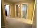 Bright hallway with carpet and doors to bedrooms and bathroom at 4332 E Oakland St, Gilbert, AZ 85295