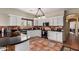 Spacious kitchen featuring granite countertops, white cabinetry, and tile flooring at 4427 S Priceless View Dr, Gold Canyon, AZ 85118