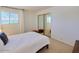 Comfortable bedroom with a double bed, mirrored closet doors, and window at 4916 N 73Rd St # 6, Scottsdale, AZ 85251