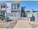 Mid-century modern building exterior with a landscaped walkway and gated entrance at 4916 N 73Rd St # 6, Scottsdale, AZ 85251