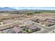 Beautiful aerial view of the property with a backyard pool, lush landscaping, and mountain views at 5013 S 112Th Ave, Tolleson, AZ 85353