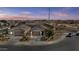Aerial view of two story house, landscaped yard, and neighborhood at 5013 S 112Th Ave, Tolleson, AZ 85353