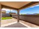 Covered patio showing an outdoor living space with paver flooring, brick wall, and mountain views at 5013 S 112Th Ave, Tolleson, AZ 85353